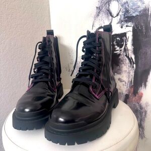 Aqua brand boots .. Black leather with pink stitching.